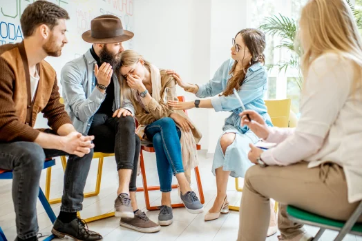 a group of people sitting in a circle