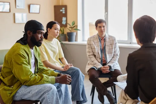 a group of people sitting in chairs