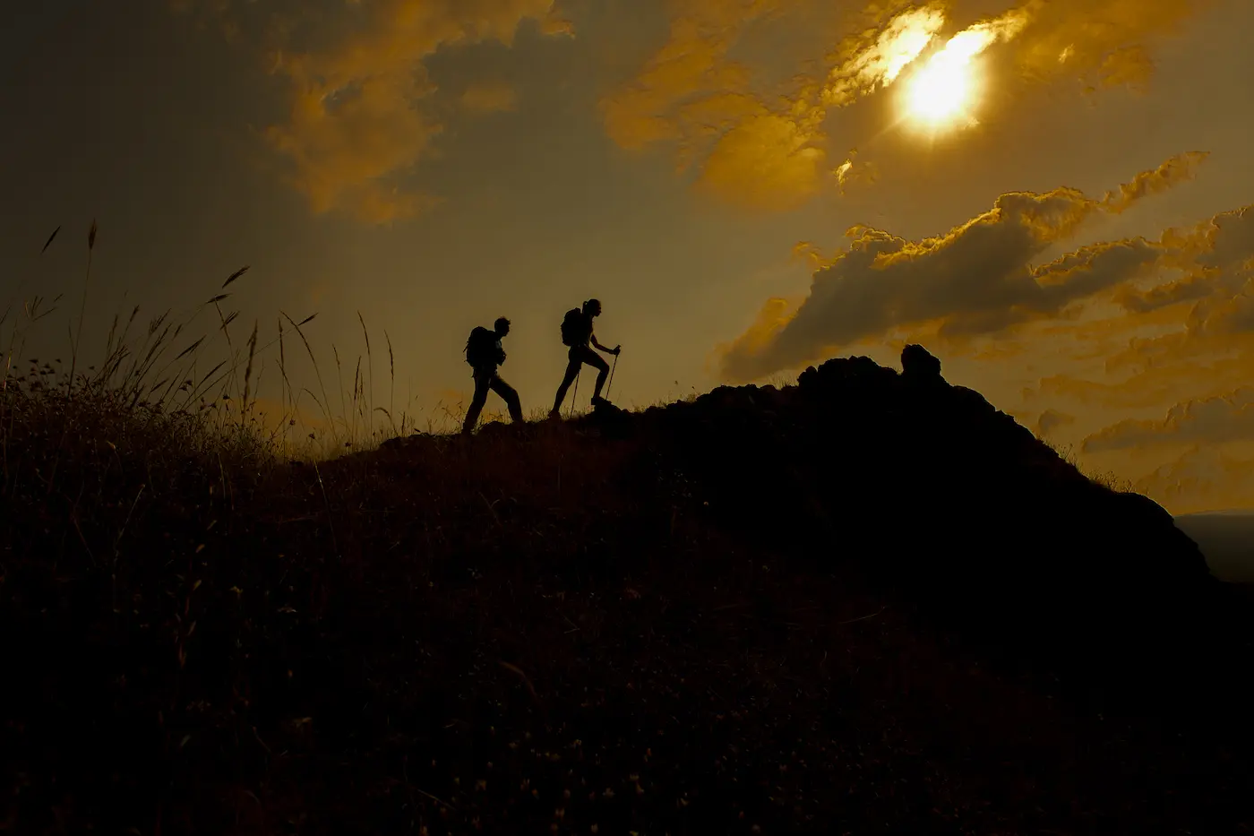 young couple hiking on a mountain